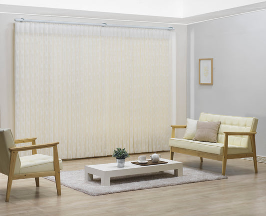 Luxx Shades Leaf in Ivory on a living room window with timber armchairs