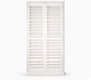 White teak plantation shutters by Total Window Concepts