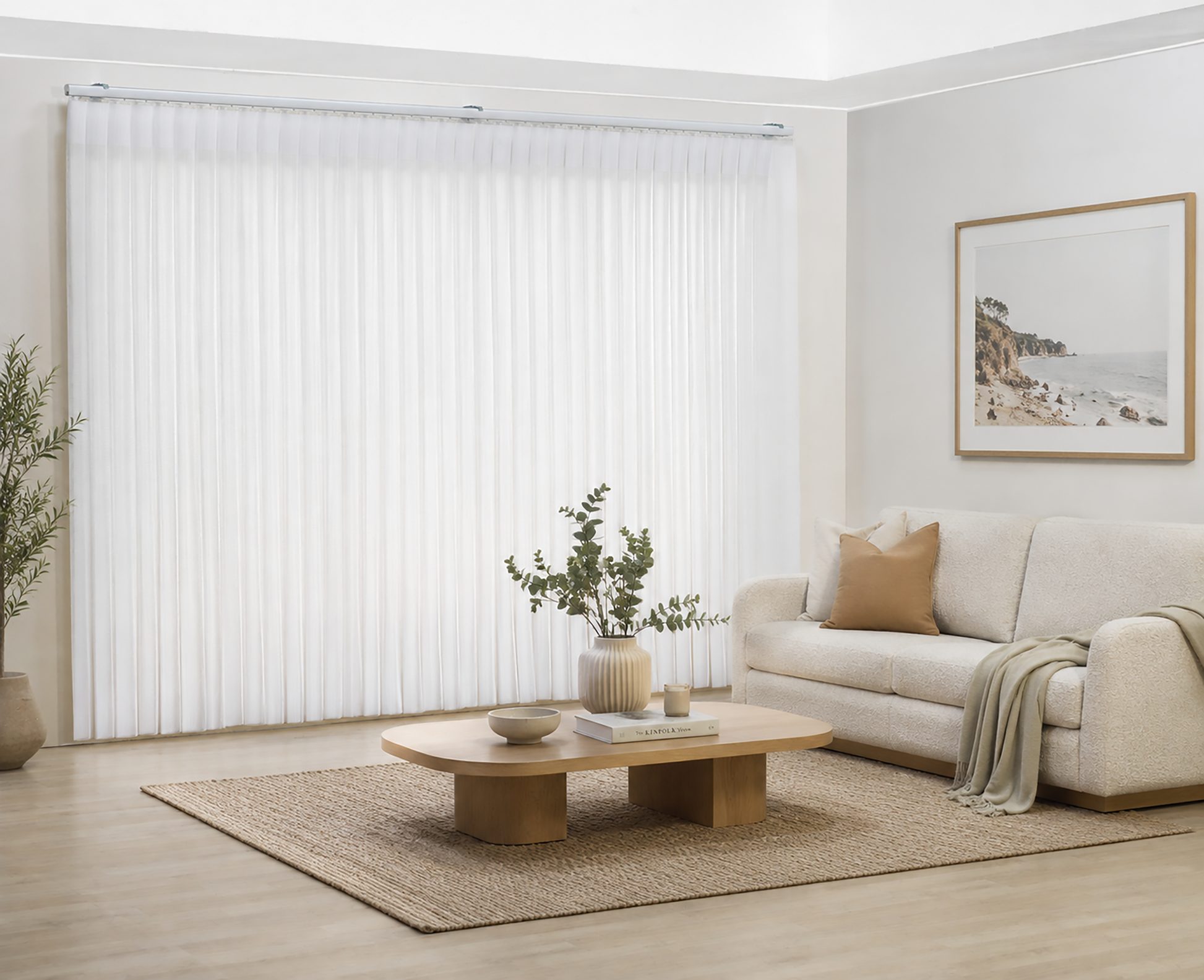 Luxx Shades closed across a wide living room window, white sheer vanes with a sofa and coffee table